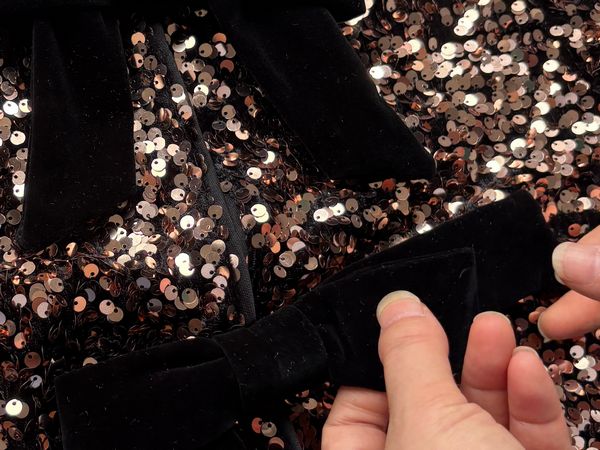 Handmade bow detail during apparel development
